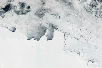 New research examines potential changes below thousands of feet of ice in East Antarctica that would affect millions of people in coastal cities worldwide by raising sea levels even more than expected in the next few centuries. Credit: Jacques Descloitres, MODIS Land Rapid Response Team, NASA/GSFC