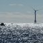 A boat passes one of the wind turbines of the Block Island Wind Farm on Oct. 14, 2016 off the shore of Rhode Island. Credit: Don Emmert/AFP via Getty Images