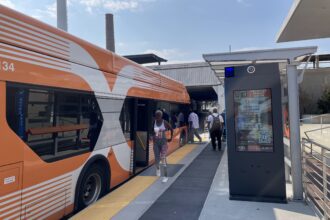 The Birmingham XPress, the city's bus rapid transit line, opened last fall with the help of federal funding. The first bus route to break free of the city's old hub-and-spoke transit design, it quickly became Birmingham's most-used public transit option. Credit: Marianne Lavelle/Inside Climate News.