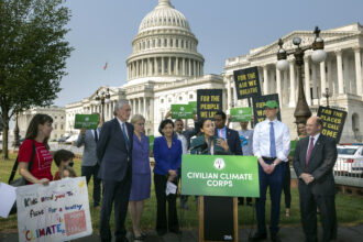 U.S. Rep. Alexandria Ocasio-Cortez (D-NY) spoke at a press conference in July 2021 urging the inclusion of the Civilian Climate Corps., a climate jobs program, in the budget reconciliation bill. Congress refused, and the corps languished, until President Biden announced on Wednesday that he would create it working through multiple agencies. Credit: Kevin Dietsch/Getty Images.