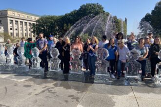 Gathered for a Climate Convergence at the Pennsylvania Capitol in Harrisburg, climate activists on Monday stood behind melting ice sculptures to demand more climate action by Gov. Shapiro and state lawmakers. Credit: Jon Hurdle.