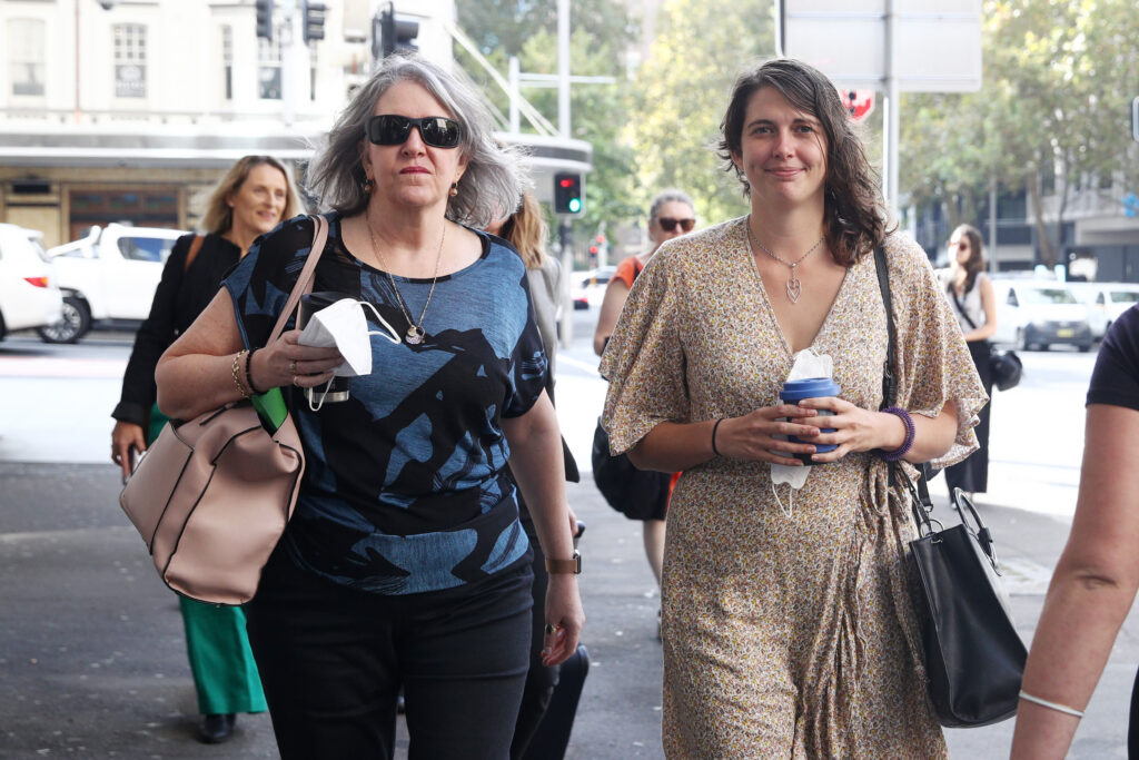 Climate Activist Deanna 'Violet' Coco, right, arrives at New South Wales District Court on March 15, 2023 in Sydney, Australia. Coco was arrested and jailed for 15 months over a protest that blocked the Sydney Harbour Bridge in April 2022, but was released as she appeals her conviction. Credit: Don Arnold/Getty Images