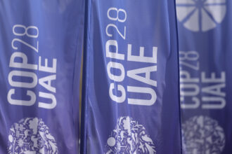 Banners fly at the UNFCCC COP28 Climate Conference in Dubai, the United Arab Emirates, before its official opening on Thursday. Credit: Sean Gallup/Getty Images