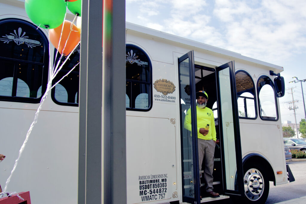 Dana Smith, a lifelong Cherry Hill resident and community advocate, peers out of the tour bus at the end of the neighborhood visit, as he reflects on the creeping gentrification, which he sees as inevitable, and what that would mean for his cherished community. Credit: Aman Azhar / Inside Climate News