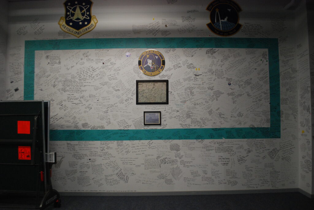 The wall at the 12th Space Warning Squadron on Thule Air Base on Sept. 25, 2022, where people have signed and left messages. Credit: Natasha Maki Jessen-Petersen