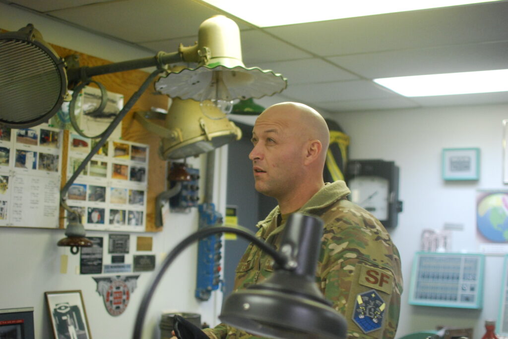 Sgt. Christopher Clark, the base’s senior enlisted leader, looks at artifacts in Thule Air Base's small museum on Sept. 25, 2022. Credit: Natasha Jessen-Petersen