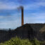 In 2018, a smokestack on the site of then-ERP Coke, within the EPA's 35th Avenue Superfund site in north Birmingham, Alabama. The facility was sold in 2019 to the family of West Virginia Gov. Jim Justice, and is now called Bluestone Coke. The facility temporarily ceased operations in 2021, but still owes the Jefferson County Health Department almost $300,000 in fines and penalties for air pollution violations. Credit: Bonnie Jo Mount/The Washington Post via Getty Images