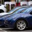 Electric vehicles (EV) line up outside a Tesla dealership in Melbourne on April 19, 2023. Credit: William West/AFP via Getty Images