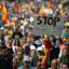 A sign reading 'Stop Geoengineering Agenda 2030' appears at a demonstration of Spanish farmers in Madrid on May 13, 2023. The demonstration was organized by SOS Rural to draw attention to rural living conditions and highlight the importance of agriculture in society and its contribution to the Spanish economy. Credit: Oscar Del Pozo/AFP via Getty Images)