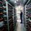 Mike Ferry, with the University of California San Diego Center for Energy Research, shows a bank of Lithium Ion batteries at UCSD