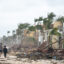 People walk along the beach looking at property damaged by Hurricane Ian on September 29, 2022 in Bonita Springs, Florida. The storm made a U.S. landfall on Cayo Costa, Florida, and brought high winds, storm surges, and rain to the area causing severe damage. Credit: Sean Rayford/Getty Images