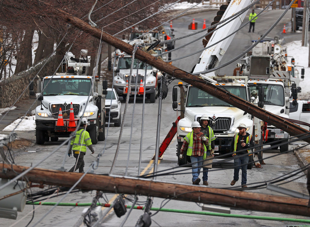 Stoneham, MA - March 1: Emergency personnel dot Montvale Avenue in Stoneham, Mass., after downed power lines trapped cars and trucks.