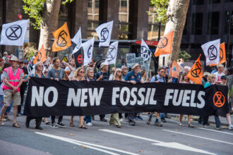 Protestors carry a large banner on Sept. 16, 2023 during the March To Demand An End To Fossil Fuels. Extinction Rebellion organizers mentioned that thousands of people joined marches across the UK in September as part of the global days of action demanding that leaders rapidly phase out fossil fuels. The demonstrators will call out the government for seeking to ‘max out’ North Sea oil and gas reserves despite warnings that there can be no new drilling if the world is to stay within habitable climate limits. The UK government is giving out hundreds of new North Sea licenses and has voiced its support for the proposed development of the huge Rosebank oil field off the Scottish coast. Credit: Loredana Sangiuliano/SOPA Images/LightRocket via Getty Images