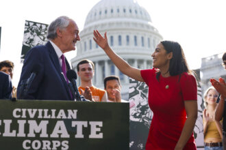 Rep. Alexandria Ocasio-Cortez (D-NY) hugs Sen. Ed Markey (D-MA) as they speak at a news conference in September 2023 on the launch of the American Climate Corps outside the U.S. Capitol. Credit: Anna Moneymaker/Getty Images.