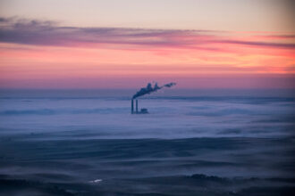 A coal-burning energy plant, as seen through cloud cover near Bismarck, North Dakota. Credit: Andrew Burton/Getty Images.