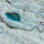 An aerial view of meltwater lakes formed at the Russell Glacier front, part of the Greenland ice sheet in Kangerlussuaq, Greenland, on Aug. 16, 2022. Credit: Lukasz Larsson Warzecha/Getty Images