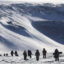 People hike near Thule Air Base on March 25, 2017 in Pituffik, Greenland. Credit: Mario Tama/Getty Images)