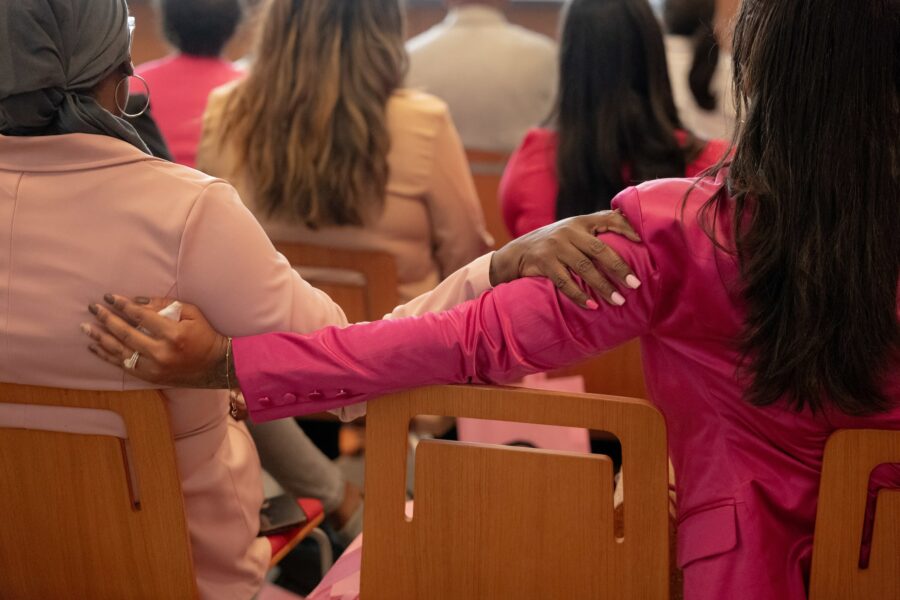 Two audience members hold each other during a screening at the Philadelphia Museum of Art of the film "A Letter to my Sisters," a documentary about young women and breast cancer produced by Nia Imani Bailey, on October 7, 2023 in Philadelphia, Pennsylvania. Credit: Caroline Gutman