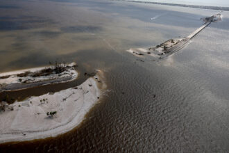 In Florida, parts of the Sanibel Causeway to Sanibel Island were washed away, along with sections of the bridge to the island, after Hurricane Ian passed through the area in September 2022. The hurricane brought high winds, storm surge and rain to the area causing severe damage. Credit:Joe Raedle/Getty Images.