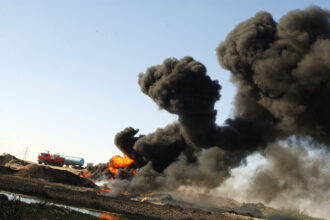 An Iraqi oil pipeline burns after sabotage by anti-U.S., pro-Saddam militants Sept. 8, 2003 near Kirkuk, in northern Iraq. Credit: Scott Peterson/Getty Images