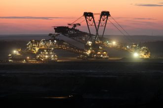 bucket-wheel excavator removes the first layer of soil for the expansion of the nearby Welzow open-pit lignite coal mine on August 20, 2010 near Drebkau, Germany. Credit: Sean Gallup/Getty Images