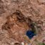 An artisanal cassiterite mine in February 2022 in Manono. The Democratic Republic of Congo is rich with Lithium, an essential mineral for electric car batteries. Credit: Junior Kannah/AFP via Getty Images