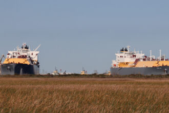 Two ocean-going LNG vessels at the Cheniere LNG export terminal in Cameron Parish, Louisiana, in March, along the Louisiana and Texas state line, near Port Arthur, Texas. Credit: James Bruggers, Inside Climate News.