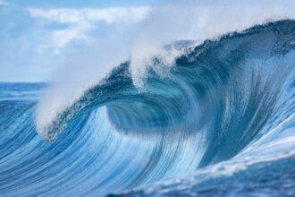 A wave crashes off Teahupoo, Tahiti, on Aug. 28, 2019. Credit: Brian Bielmann/AFP via Getty Images