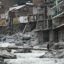 In a photo taken on May 4, 2023, residents cross a temporary bridge near hotels and houses that were damaged by flash floods on the banks of the Swat River in 2022 in Bahrain, a town in the Swat valley in Khyber Pakhtunkhwa province of Pakistan, which was lashed by unprecedented monsoon rains over the summer of 2022. The ensuing floods that put a third of the country underwater, damaged two million homes and killed more than 1,700 people. Credit: Aamir Qureshi / AFP via Getty Images