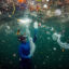 A Turkish diver dives amid plastic waste in Ortakoy coastline to observe the life and pollution of Bosphorus in Istanbul, Turkey on June 27, 2020. Credit: Sebnem Coskun/Anadolu Agency via Getty Images