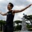 Canadian activist and artist, Benjamin von Wong is pictured in front of his 30-foot monument themed 'turn off the plastics tap' created using plastic waste from Nairobi's largest slum, Kibera, standing outside the venue of the Fifth Session of the United Nations Environment Assembly, at the United Nations Environment Programme (UNEP) Headquarters in Nairobi on Feb. 22, 2022. Credit: Tony Karumba/AFP via Getty Images