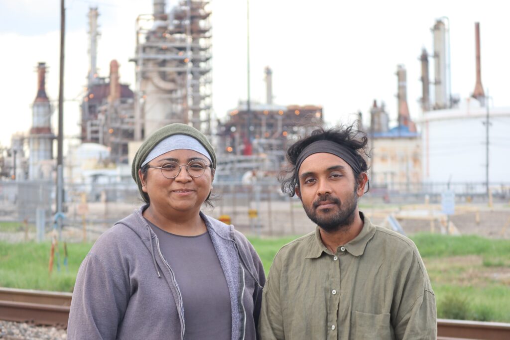 Yvette Arellano and Shiv Srivastava with the Houston-based environmental justice group Fenceline Watch, stand near the LyondellBasell Houston Refinery. Credit: James Bruggers/Inside Climate News