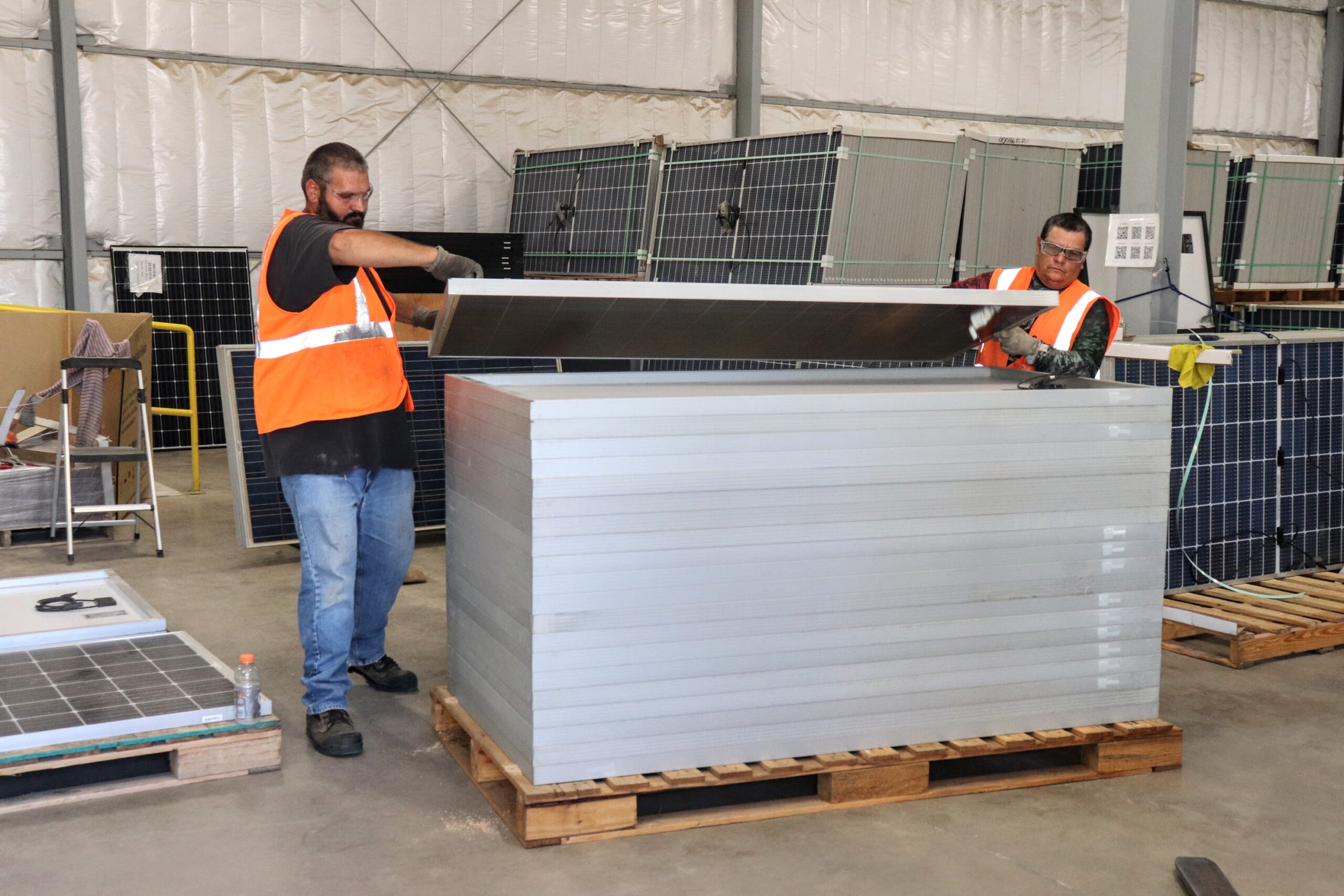 Reusable solar panel frames are stacked and bundled at We Recycle Solar in Yuma, Arizona, on August 8, 2023. Credit: Emma Peterson.