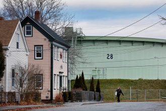 A Portland Pipe Line tank next to the Ferry Village neighborhood in South Portland, Maine. Derek Davis/Portland Press Herald via Getty Images