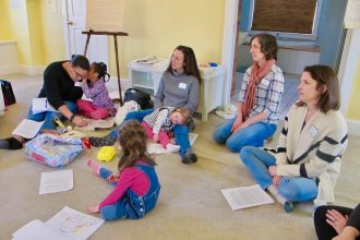 A group of concerned parents and their young kids listen as Protect South Portland organizers talk about how to engage in the activists’ fight for clean air. Credit: Sabrina Shankman/InsideClimate News