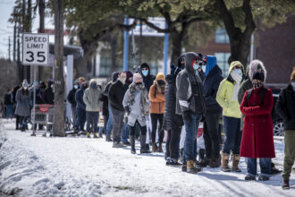 People wait in line at a grocery store in Austin, Texas on Tuesday, Feb. 16, 2021. Credit: Sergio Flores for The Washington Post via Getty Images
