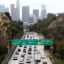 Cars make their way toward downtown Los Angeles, notorious for traffic and air pollution, a silent killer now linked to brain development problems in young children. Credit: Mario Tama/Getty Images.