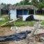 Badly damaged buildings are pictured near Vanuatu's capital of Port Vila on April 7, 2020, after Tropical Cyclone Harold swept past and hit islands to the north. The cyclone caused $600 million in damage, some 60 percent of the small Pacific island nation's GDP. Credit: PHILIPPE CARILLO/AFP via Getty Images.