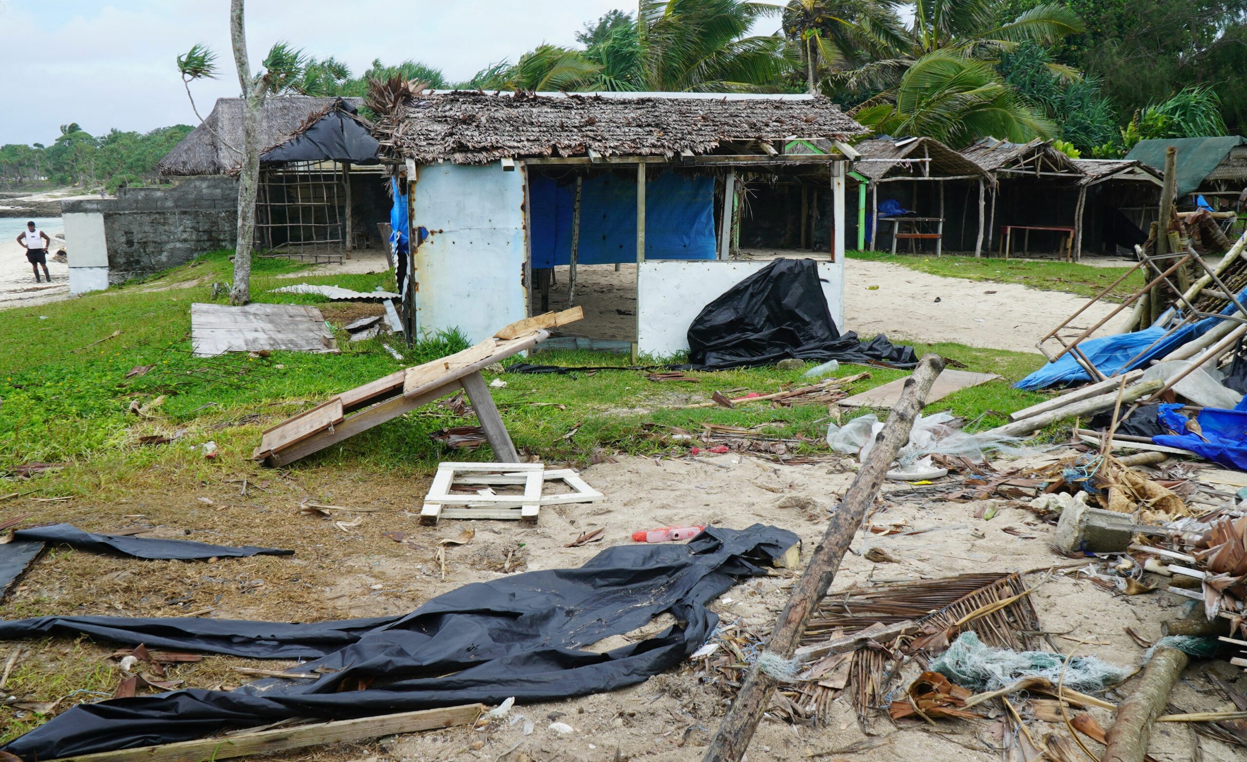Badly damaged buildings are pictured near Vanuatu's capital of Port Vila on April 7, 2020, after Tropical Cyclone Harold swept past and hit islands to the north. The cyclone caused $600 million in damage, some 60 percent of the small Pacific island nation's GDP. Credit: PHILIPPE CARILLO/AFP via Getty Images.