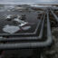 Pipelines extend across the landscape outside Nuiqsut, Alaska, 36 miles from the Willow Master Development Plan located in the National Petroleum Reserve on Alaska's North Slope. Credit: Bonnie Jo Mount/The Washington Post via Getty Images.