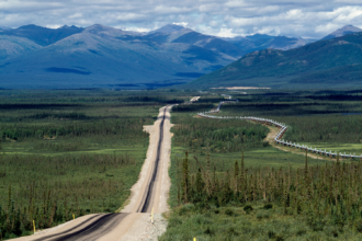 Dalton Highway and the Trans-Alaska Pipeline are seen in Alaska. Credit: DeAgostini/Getty Images